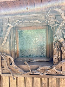 Image window with driftwood